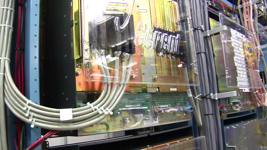 sweeping past racks of computer servers and equipment