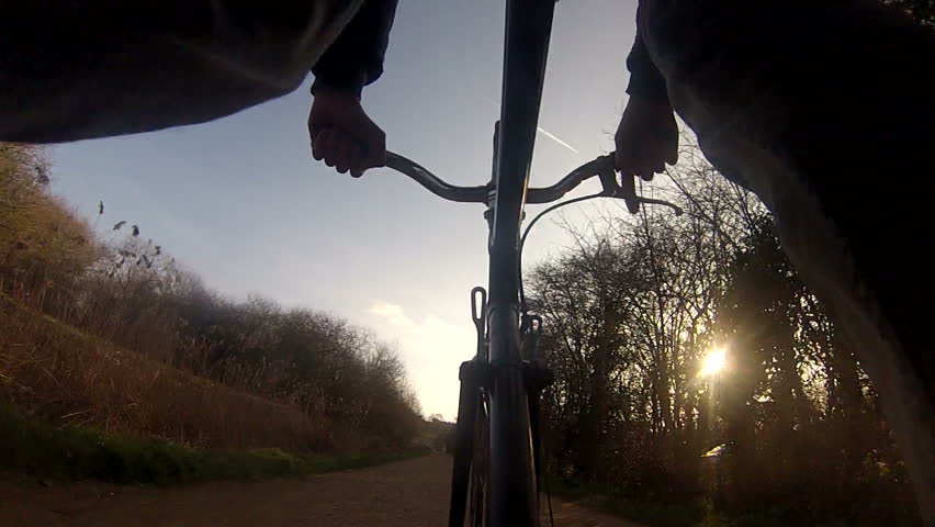 Bike riding silhouette with flare. pov