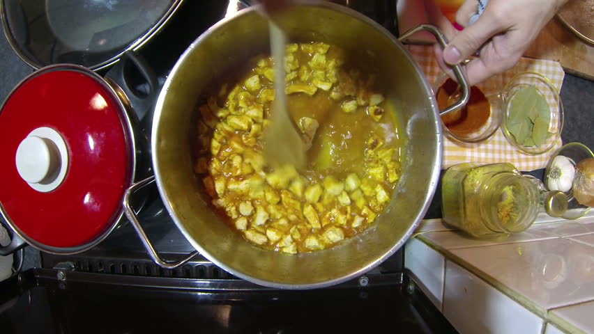 Chef Cooking Chicken Stew.
Male chef stirring meal in pot on stove. HD1080p.