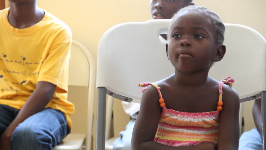 PORT AU PRINCE HAITI  - CIRCA MAY 2012: child waits for Dr. at vaccination clinic