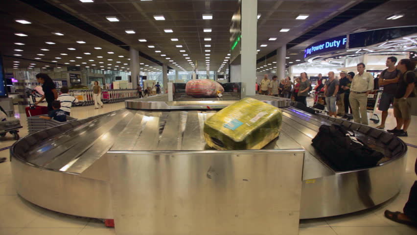 BANGKOK - MARCH 14. Timelapse of passengers at baggage reclaim in Bangkok airport on March 14, 2012. Suvarnabhumi airport is world's 4th largest single-building airport terminal.