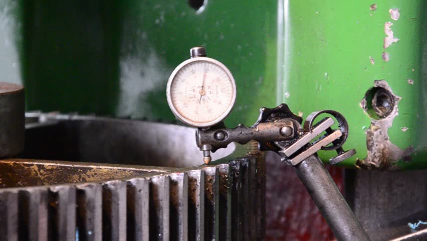 dial gauge instrument measures inclination of cogwheel gear ready for service