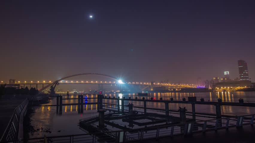 SHANGHAI - CIRCA 2013: Time Lapse of River Traffic at Night by Lupu Bridge in Shanghai, China. Photo Sequence from DSLR camera and Post production in After Effects