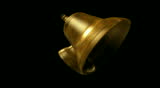 Two large golden copper bell that swing back and forth while ringing.  The video is seamlessly looped and has an luma channel.