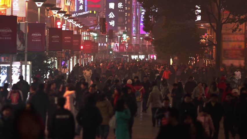 SHANGHAI - CIRCA JANUARY 2013 - Busy Night Crowds Traffic on Nanjing Road in Shanghai, China