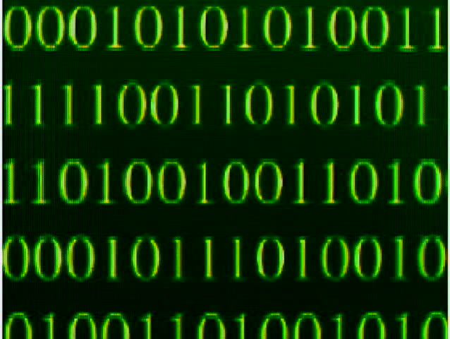 Zooming out, showing more and more O's and 1's flashing across a black screen