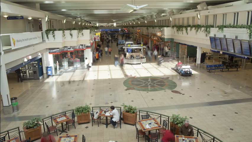 Indoor Airport time-lapse with people crowds cart trail effect