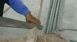 Carpenter sawing wood