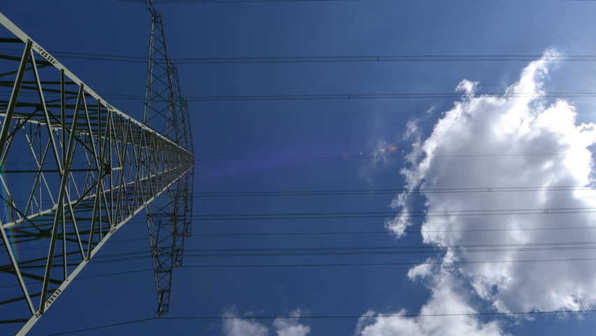 A high voltage electricity pylon time lapse a zoom. 10877

