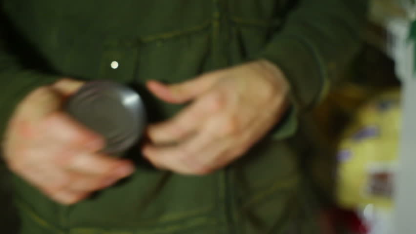 Stealing a can from a store, shoplifting.