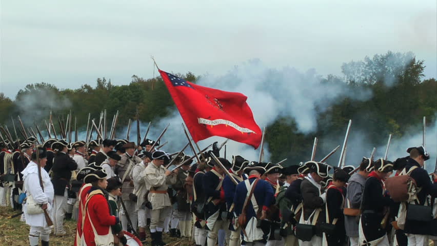 VIRGINIA - OCTOBER 2009 - large-scale, epic American Revolutionary War anniversary reenactment -- in the middle of battle.   Continental Army infantry volleys and fires in line of battle - Militia.