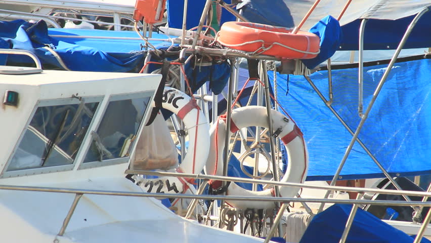 two white life preservers tied to a boat anchored at Jaffa port
