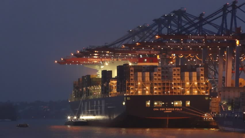 Hamburg,Germany - December 12, 2012, Container ship at the Burchardkai - a terminal at the harbour in Hamburg. Night shot. 