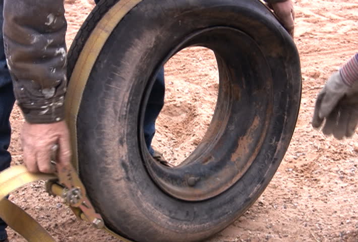 Struggling to inflate an old tire.