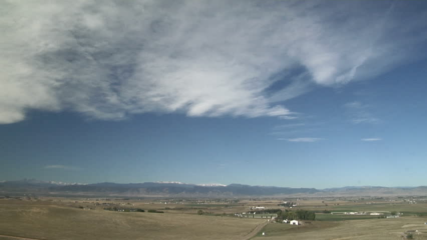 Mountain Waves and Contrails. Cirrus clouds are formed in the crests of a broad mountain wave updraft