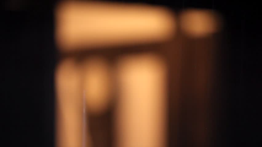 Clock. Slow focus change, from unfocused foreground to the clock on the background.
