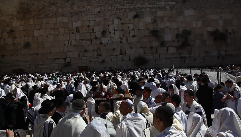 JERUSALEM, ISRAEL -  MARCH 28: Thousands of Jews practice the Priestly Blessing  (Hebrew - Birkat Cohanim) at the Western Wall plaza during the Passover Holiday, March 28 2013 in Jerusalem, Israel.