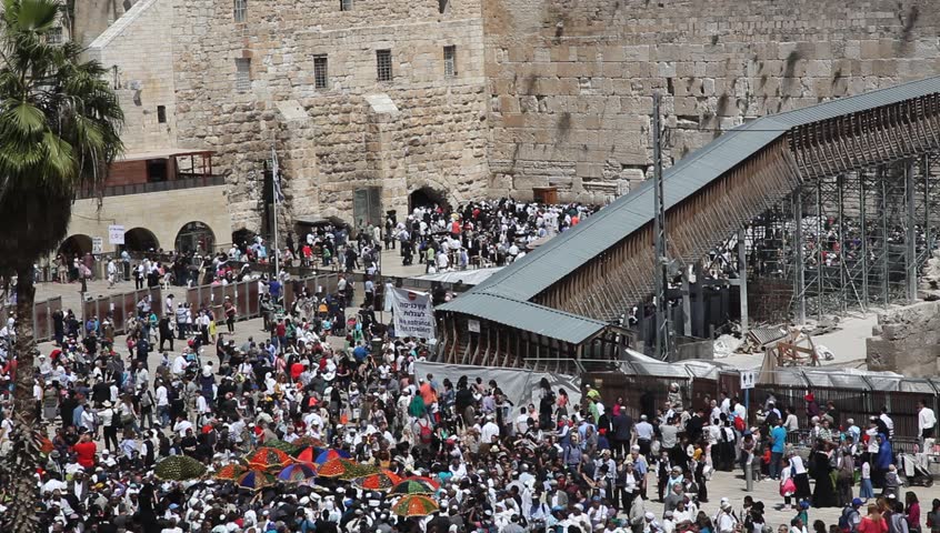 JERUSALEM, ISRAEL -  MARCH 28: Thousands of Jews practice the Priestly Blessing  (Hebrew - Birkat Cohanim) at the Western Wall plaza during the Passover Holiday, March 28 2013 in Jerusalem, Israel.