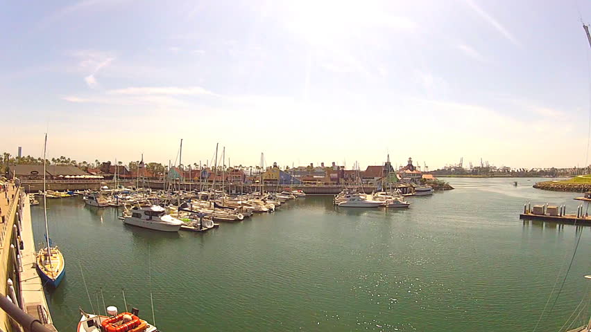 LONG BEACH, CA - APRIL 2, 2013: Boats and yachts docked in Shoreline Marina with Shoreline Village in the background circa 2013 in Long Beach. Shoreline Marina / Village are major tourist attractions.