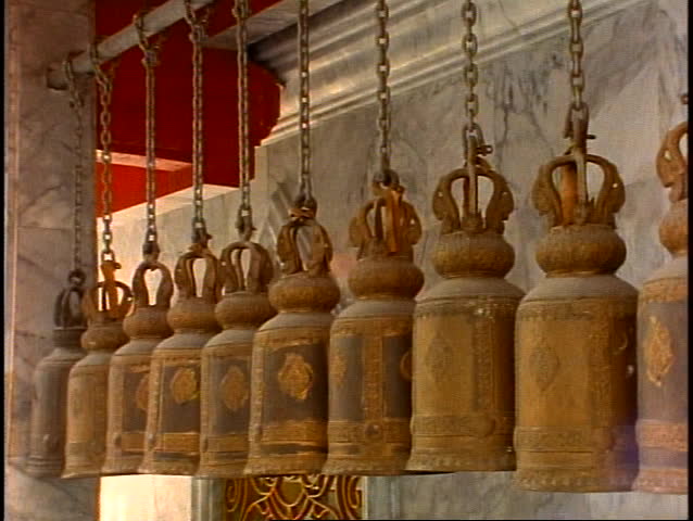 Temple bells in a Thai Buddhist Temple, medium close up, tilt down