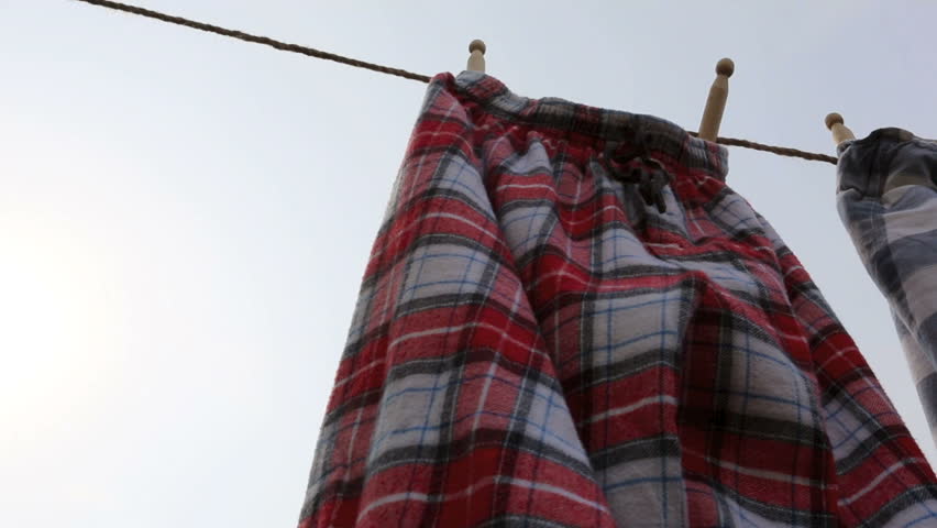 Red Checked Pajamas blowing in the wind on washing line