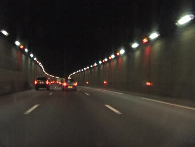Driving through the tunnels on the highway near Paris in France