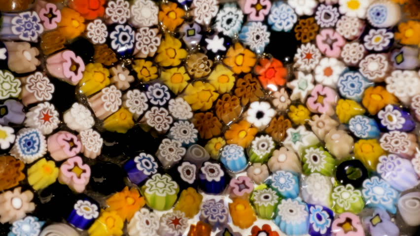 A kaleidoscope of flowers, obtained with a rotation of a painted glass.