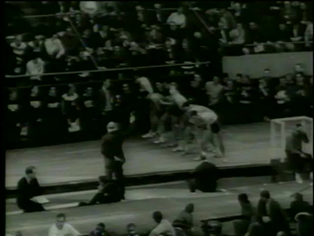 Start of 1000-yard run at the track season of The Knights of Columbus meet in Boston circa 1964-MGM PICTURES, UNIVERSAL-INTERNATIONAL NEWSREEL, USA, filmed in 1964  