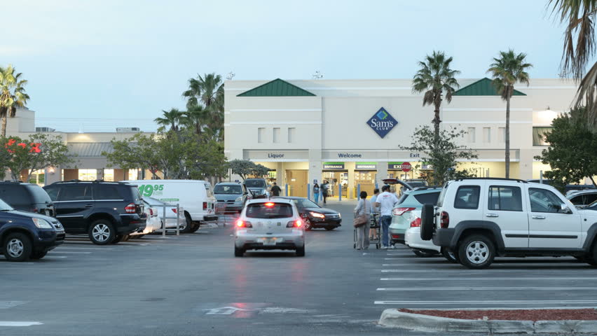 MIAMI - APRIL 13: Timelapse footage of a Sams Club wholesale supermarket parking lot during dusk April 13, 2013 in Miami, Florida. 