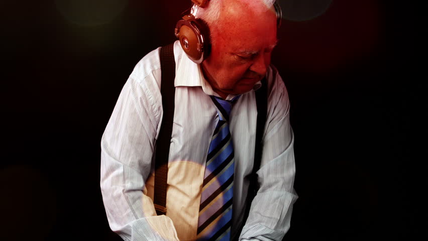 a very funky elderly grandpa dj mixing records
