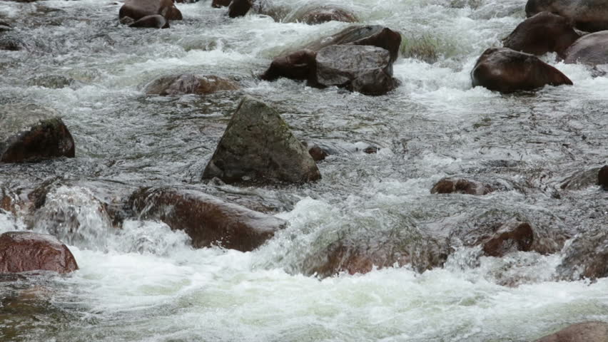 Sierra Nevada California mountain river fast timelapse. Beautiful Sierra Nevada mountain river flowing into the Sacramento valley.  Mountain range in the U.S. states of California and Nevada.