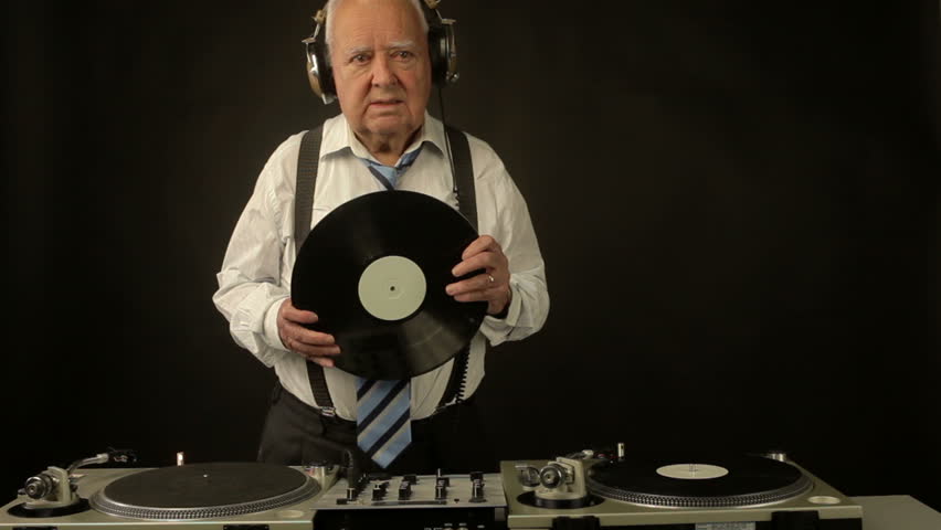 a very funky elderly grandpa dj mixing records
