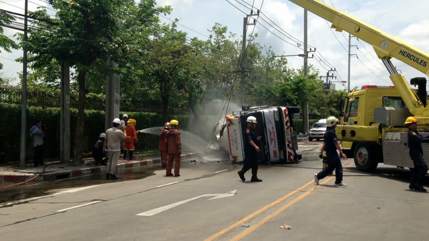 BANGKOK - APRIL 15: A rolled-over gas truck is being craned back on wheel in Bangkok, Thailand, on April 15, 2013. The gas truck crashed after a brake failure