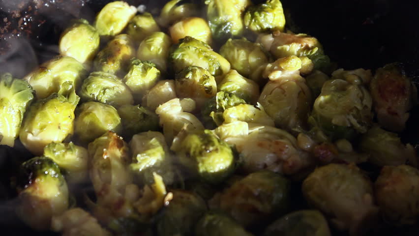 Fried brussels sprouts on a frying-pan