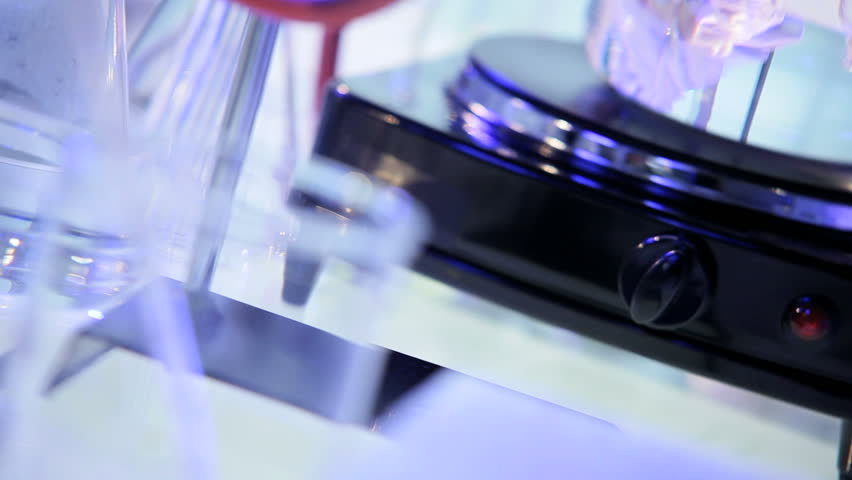 Male Caucasian hands close up scientific researcher testing future vaccines on glass slides