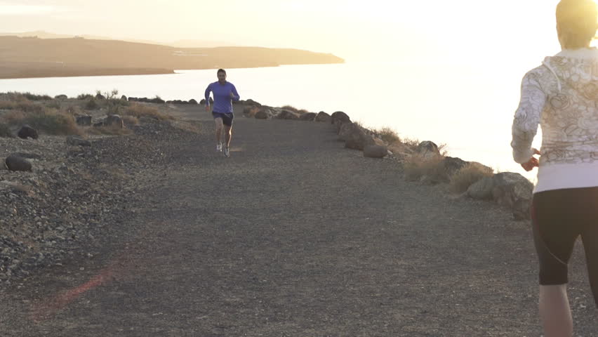 People jogging by the sea, super slow motion, shot at 240fps

