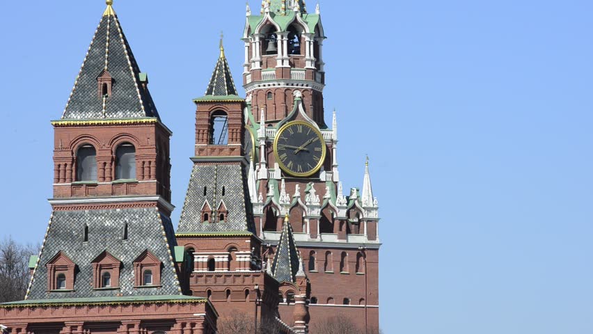 Moscow Kremlin, Red Square and GUM store. Zoom in to and zoom out of Spasskaya Tower and Kremlin clock.