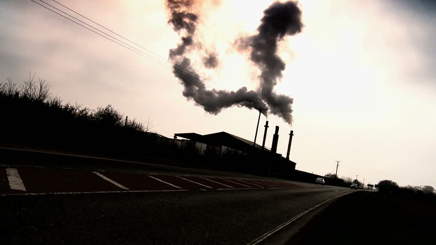 Smoking chimneys polluting the air