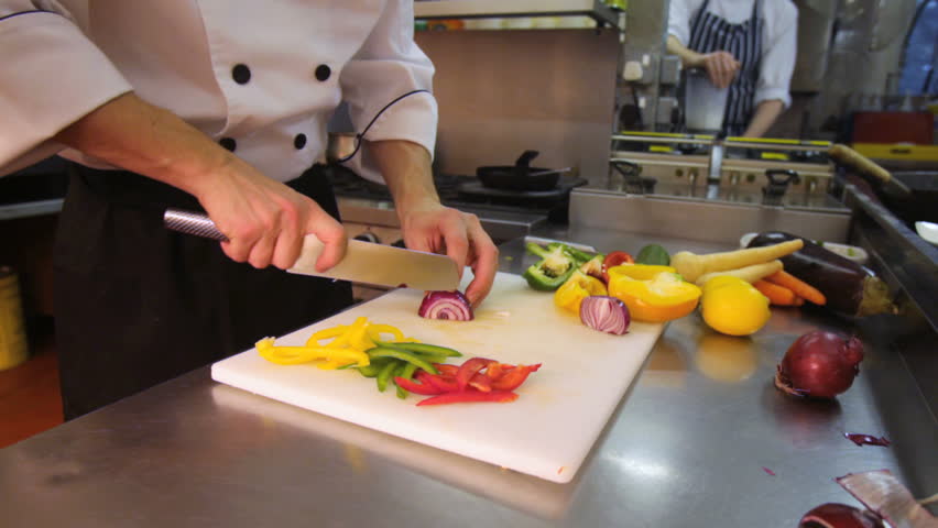 Chef slicing onions