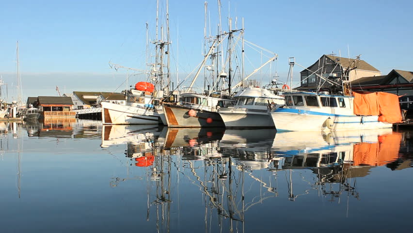 Steveston Fisherman's Wharf Reflections. An early morning on the docks of touristy Fisherman's Wharf in Steveston, British Columbia, Canada near Vancouver at the mouth of the Fraser River.