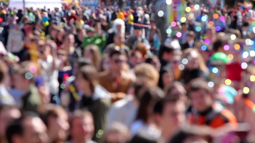 Crowd people walking on the festival of soap bubbles. Unrecognizable people.