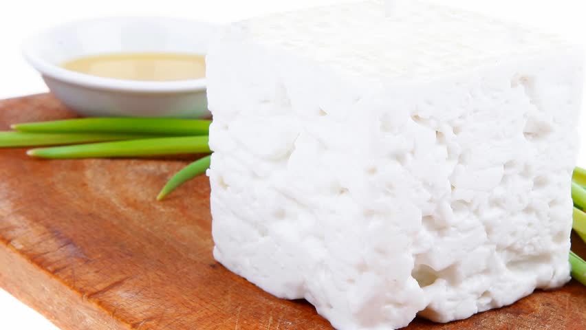 dairy food : feta white cheese cubes over small cut wooden plate 1920x1080 intro motion slow hidef hd