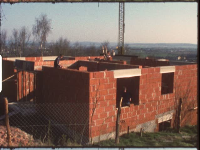 Vintage 8mm film: Housebuilding, children laying bricks