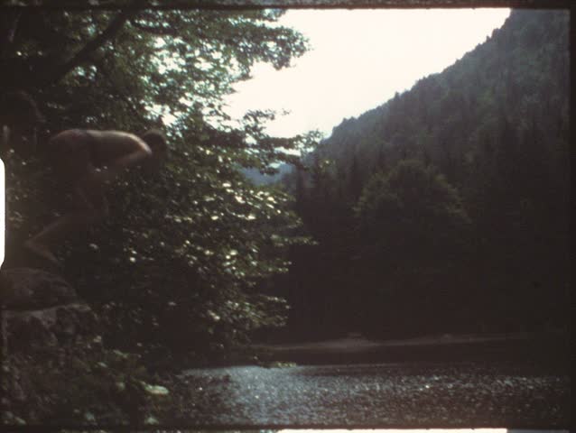 Vintage 8mm film: Children jumping in lake