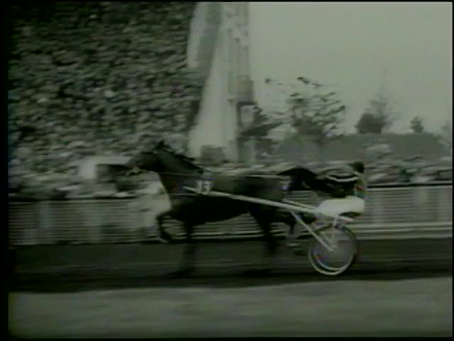 "Nike Hanover" with rider Fromming of Germany winning at  Prix d'AmÃ©rique harness race, theÂ VincennesÂ hippodrome inÂ Paris circa 1964-MGM PICTURES, UNIVERSAL-INTERNATIONAL NEWSREEL, USA, filmed in 1964
