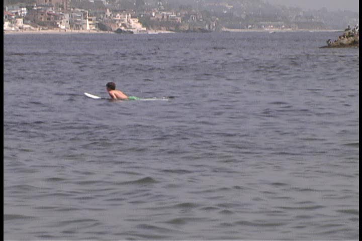 Surfer misses a wave