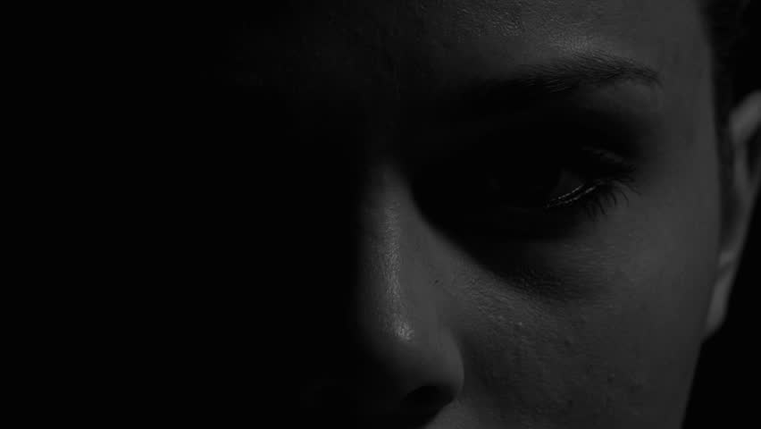 Woman's eyes in black and white. Experimental lighting. 