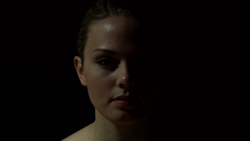 Woman's face in color. Experimental lighting.