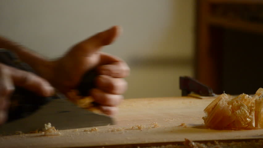 Luthier or carpentry with planer wood in action