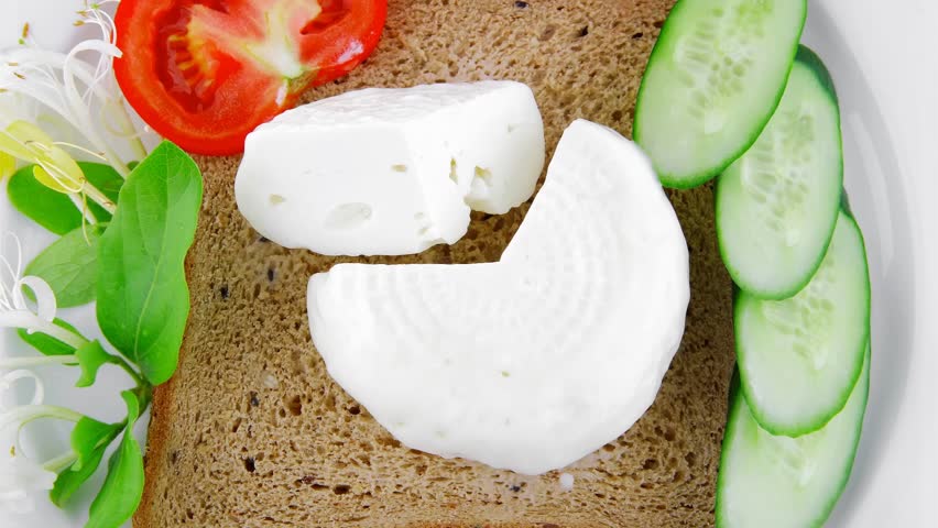 light feta and tomatoes on big white plate 1920x1080 intro motion slow hidef hd